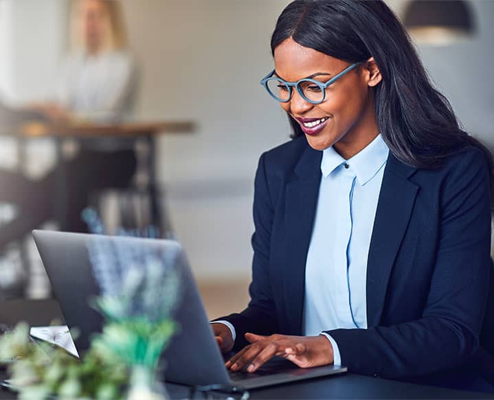 black woman at computer typing